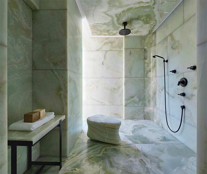 bathroom with light green marble tiles shades