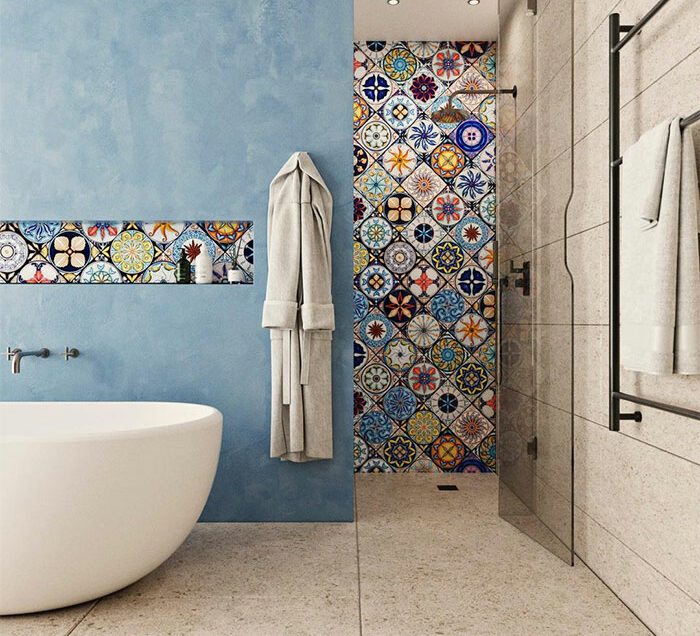 Bathroom with beautiful puzzle tile design on shower wall and accent strip against blue and beige walls. Bathroom with beautiful puzzle tile design on shower wall and accent strip against blue and beige walls.