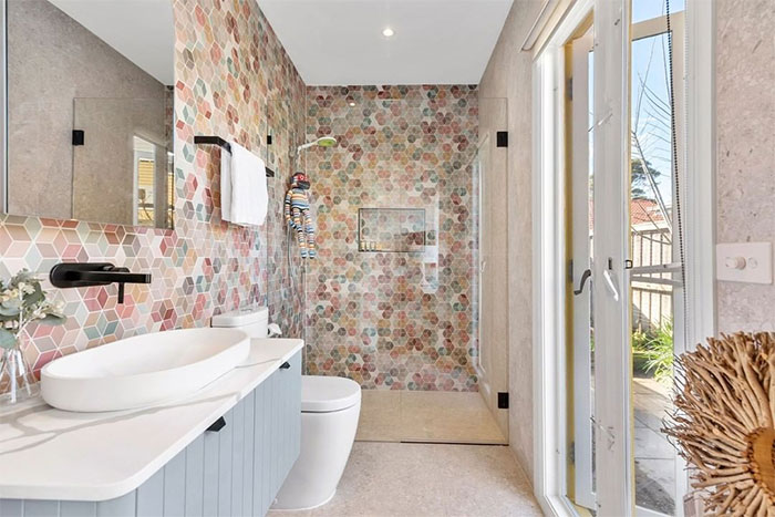 bathroom with small and colorful geometrical puzzle tiles