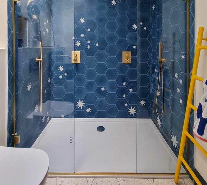 creative bathroom with blue hexagon tiles with stars