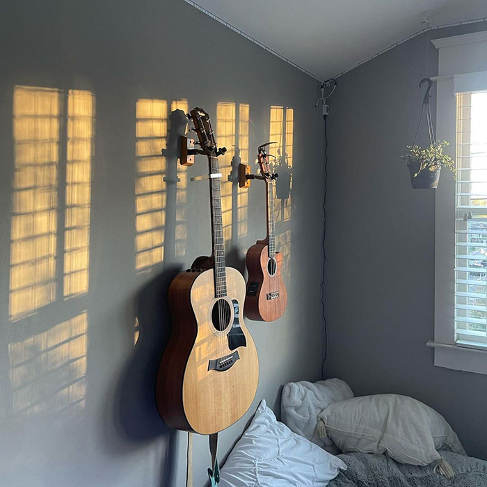 Guitar hanging on the wall in the bedroom