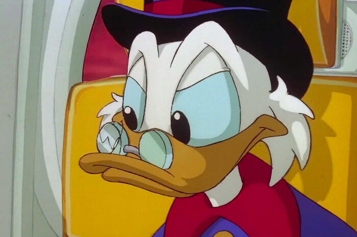 Scrooge McDuck looking at someone 