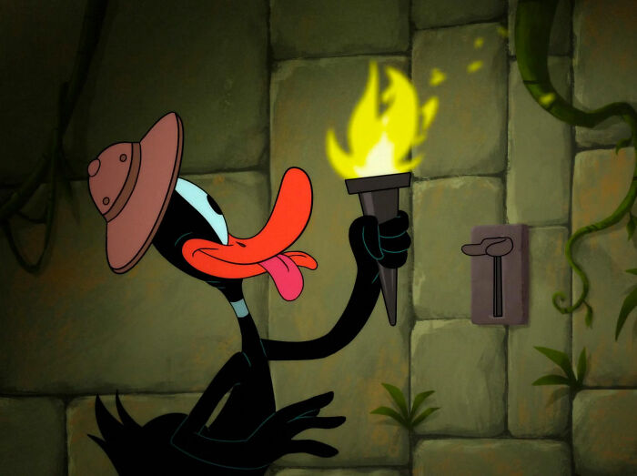 Daffy Duck with a torch in a building