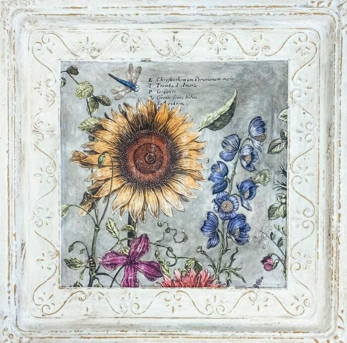 White chalk-painted picture frame with flowers painted in it