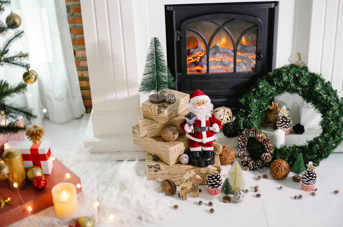 Christmas decorations and toys near fireplace