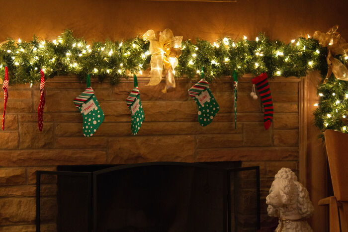 colorful stockings near fireplace 