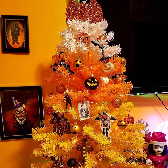 Orange Christmas tree with Halloween ornaments 
