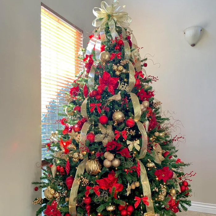 Christmas tree with oversized ribbon topper 