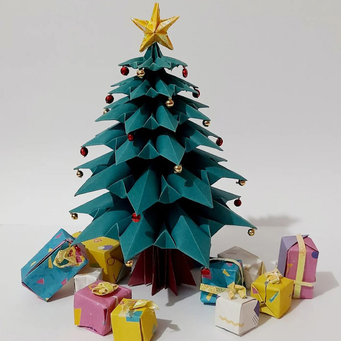 Origami Christmas tree and presents under it 