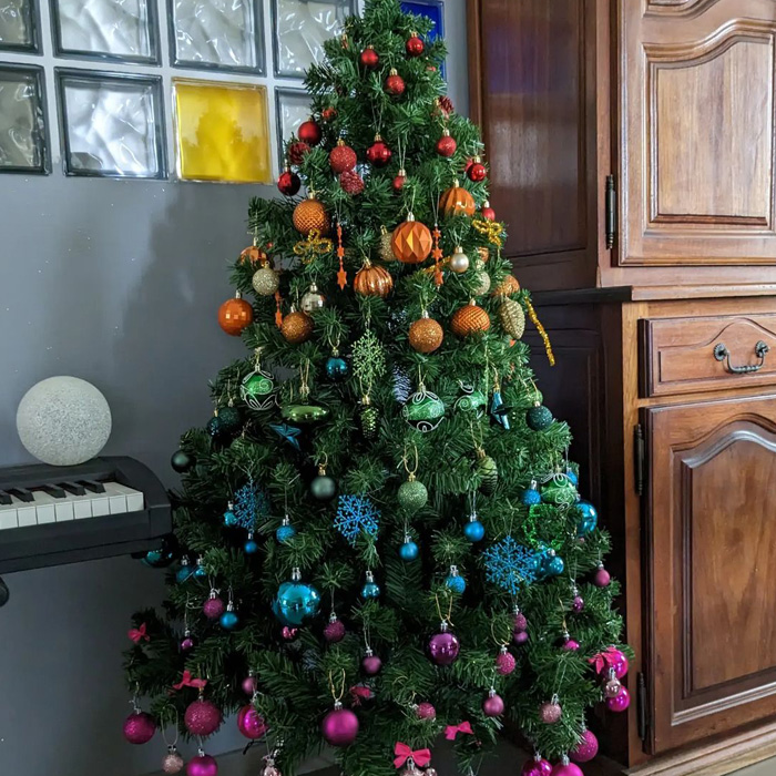 Christmas tree decorated in rainbow colors 