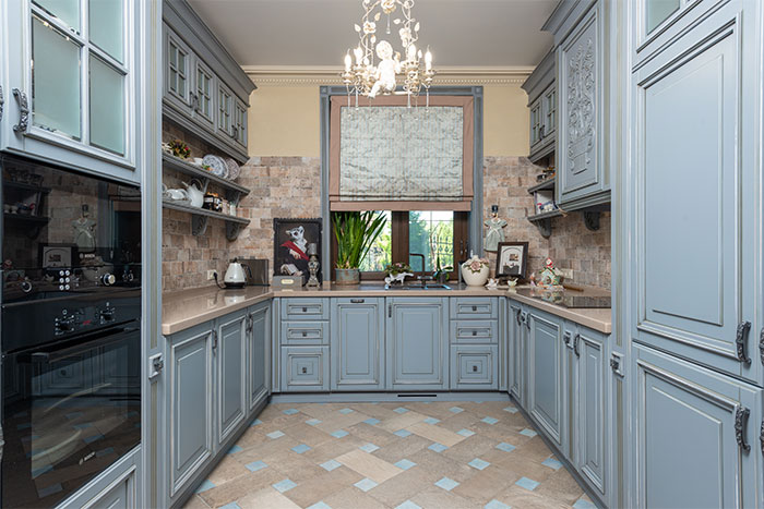 Country kitchen with light blue cupboards