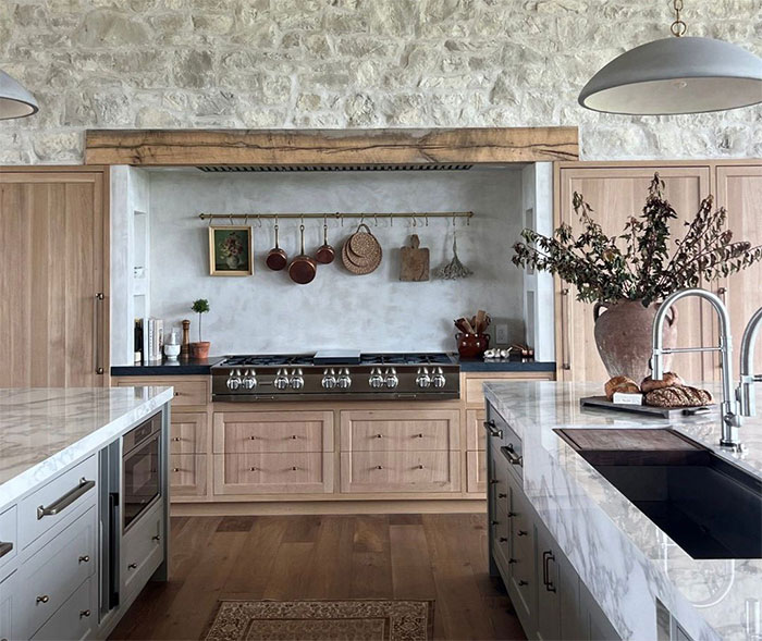 Country kitchen with stone decor and wooden cupboards