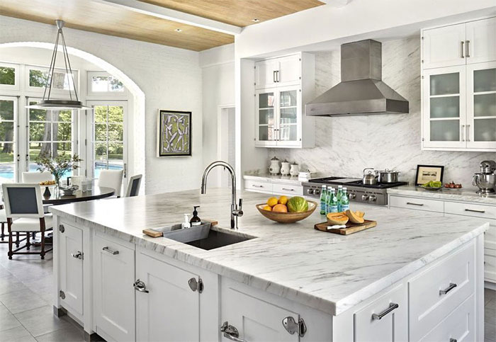 Country white kitchen with marble decorations