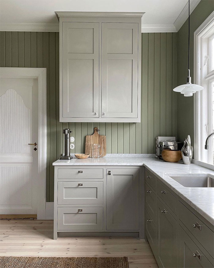 Country kitchen with light green decor