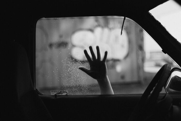 Person hand at car window