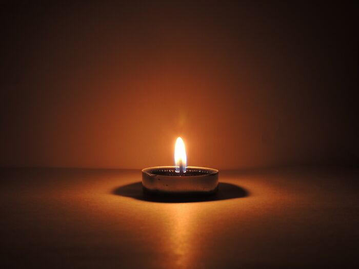 Candle lighted in the dark