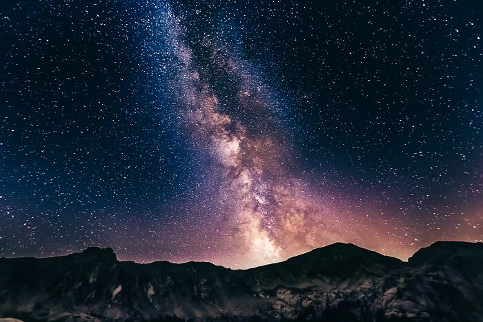 sky full of stars with mountains