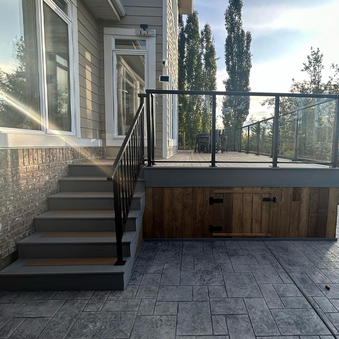 Modern backyard deck with black railings and wooden accents, showcasing creative backyard deck ideas for outdoor enjoyment. Modern backyard deck with black railings and wooden accents, showcasing creative backyard deck ideas for outdoor enjoyment.