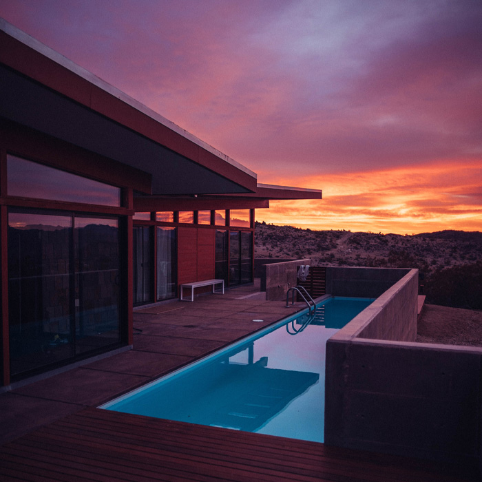 Swimming pool built-in within a deck during golden hour 