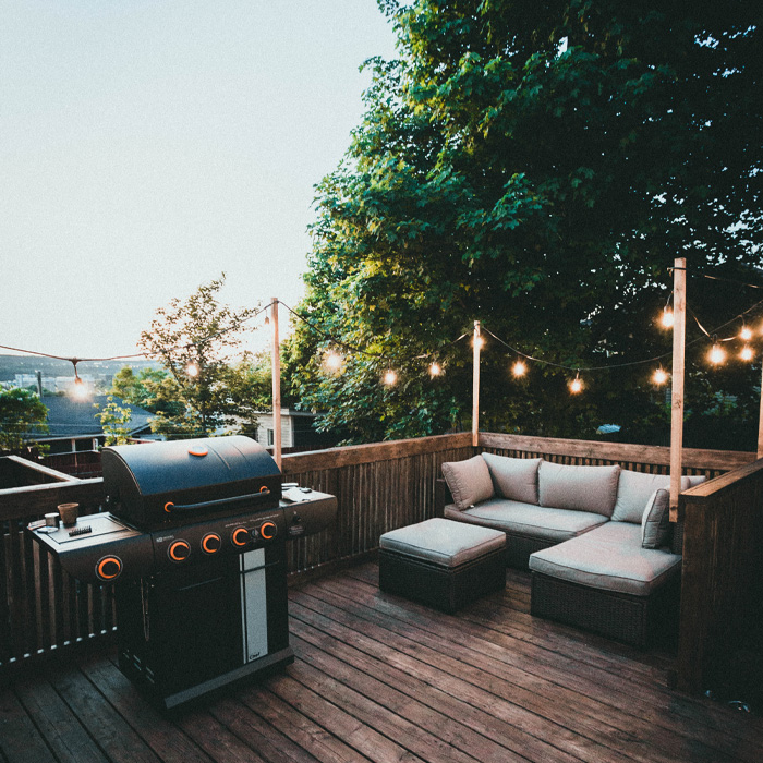 Black grill on the wooden deck 