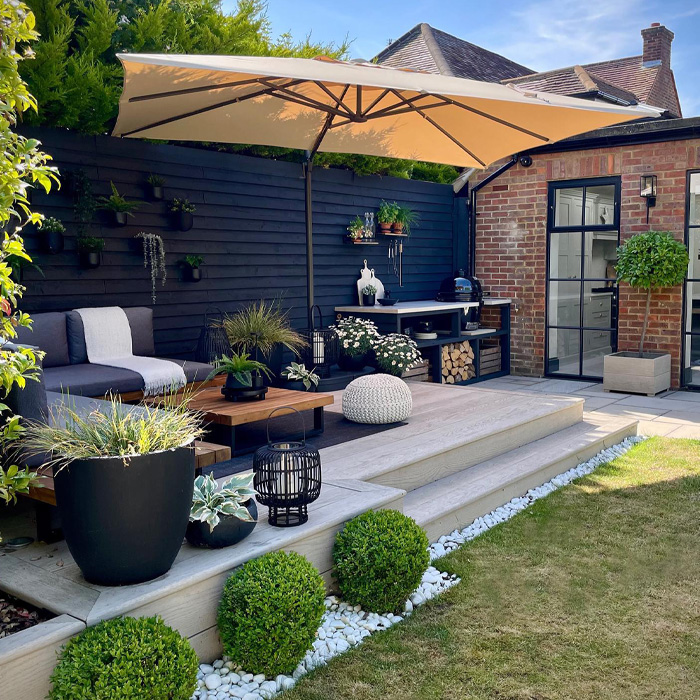 Backyard deck with canopy and plants creating a cozy outdoor space for creative backyard deck ideas. Backyard deck with canopy and plants creating a cozy outdoor space for creative backyard deck ideas.
