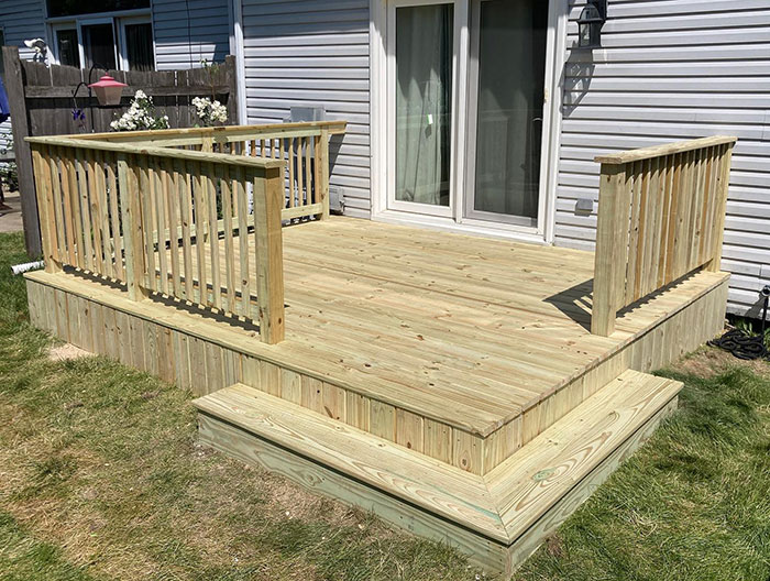 Pine wood deck with classic deck railing design, enhancing exterior style and outdoor living space. Pine wood deck with classic deck railing design, enhancing exterior style and outdoor living space.