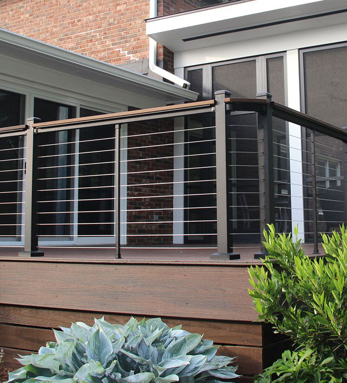 Black metal horizontal deck railing on a wooden porch enhancing modern exterior design with sleek minimalist style. Black metal horizontal deck railing on a wooden porch enhancing modern exterior design with sleek minimalist style.