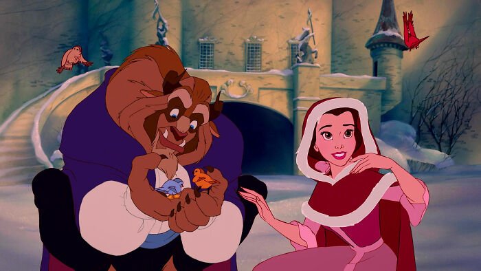 Beauty and the Beast looking and smiling