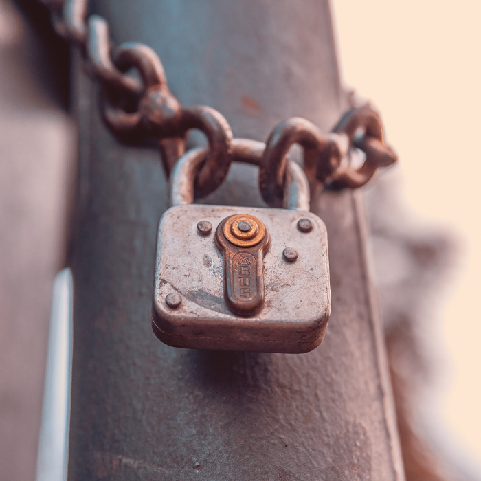 Grey padlock in chain 