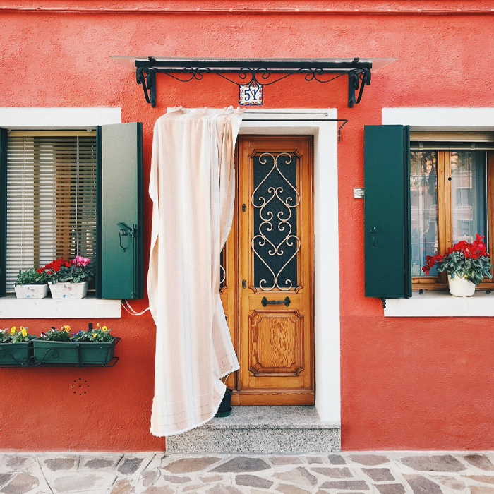 Orange house with wooden door 