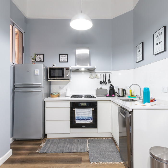 Grey kitchen with white cabinets 