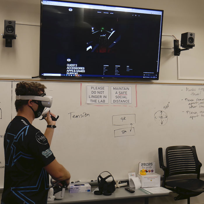 scoreboard in a game room and a vr set 