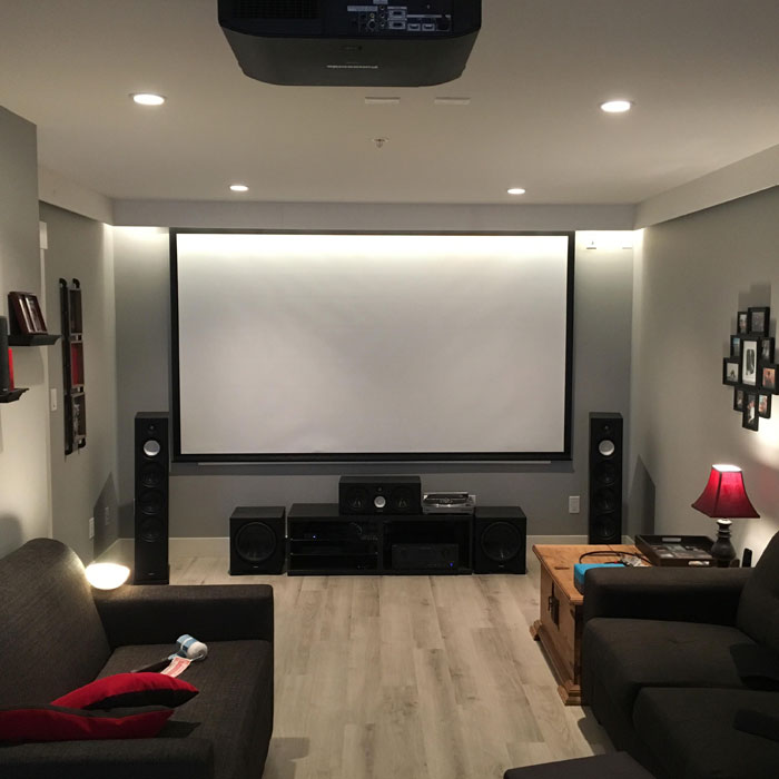 Bright home theater with projector in it 