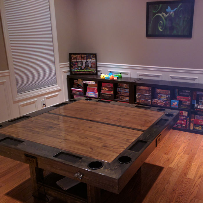 Brown DIY game table in a cozy game room with shelves full of board games, perfect for game room ideas and gaming cave setups Brown DIY game table in a cozy game room with shelves full of board games, perfect for game room ideas and gaming cave setups