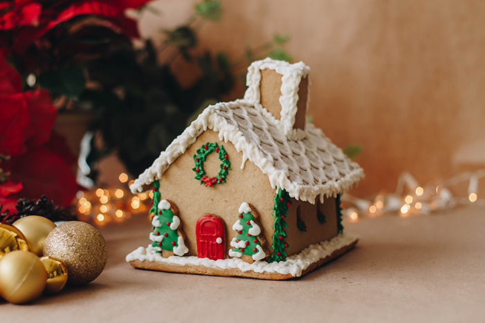 A gingerbread house decorated with christmas decorations.