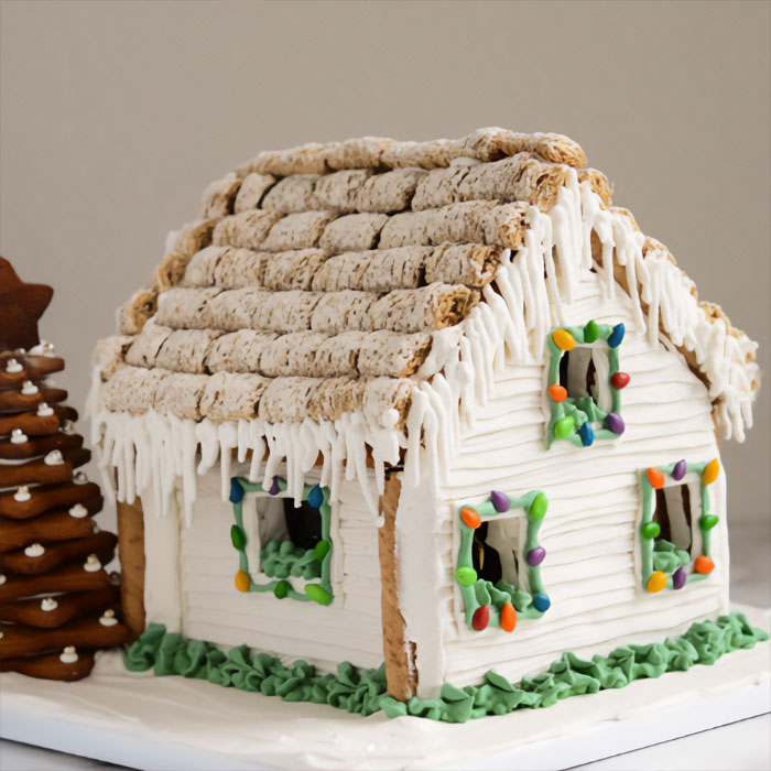 Gingerbread house decorated with white textured walls.