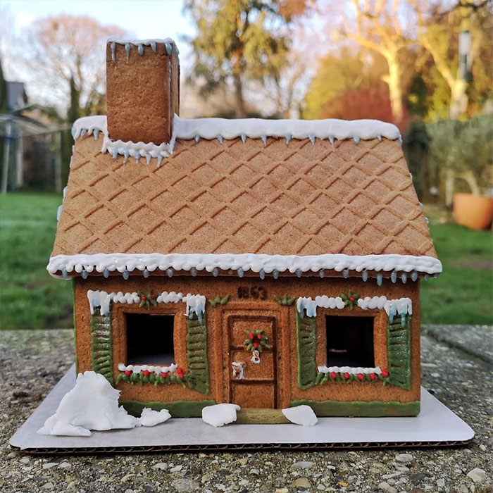 Gingerbread house with ornamental roof.