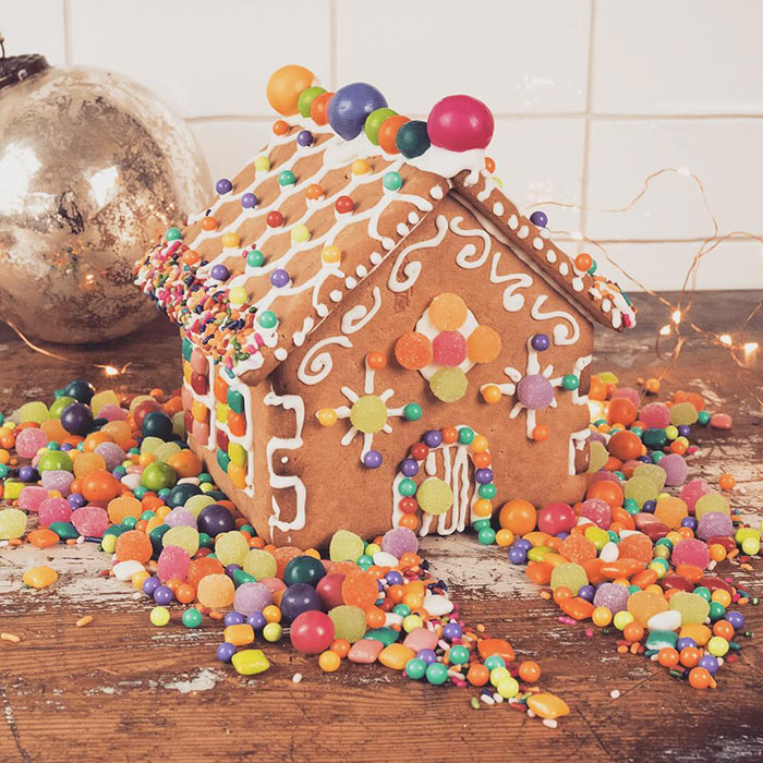 Gingerbread house decorated with candies.