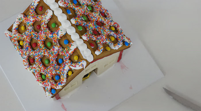 Gingerbread house roof covered with sprinkles.