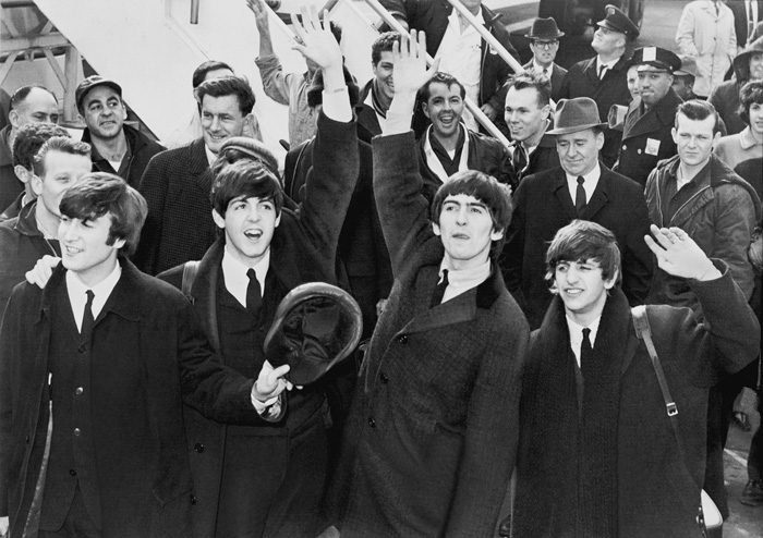 The Beatles members waving 
