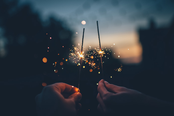 Persons holding sparklers