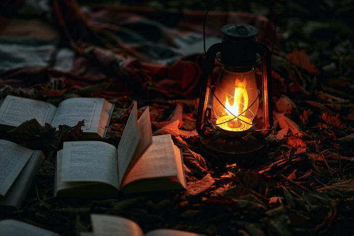 Lantern with books near