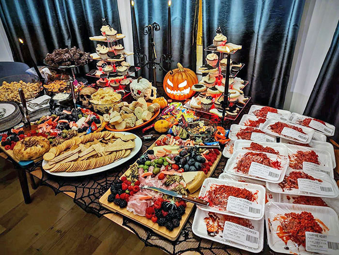 Our Halloween Charcuterie Spread, Pumpkin Spice, Cream Cheese Frosting Cupcakes, Skeleton Brownies, And Rice Krispie Treats. Not Raw Meat