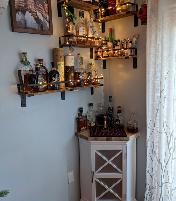 Small white corner table and a home bar 