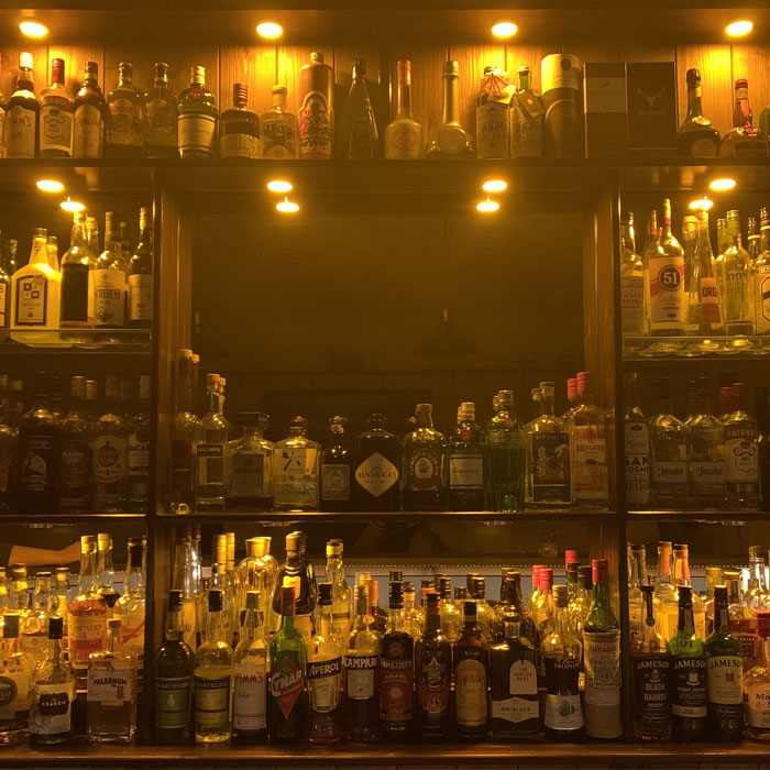 Yellow recessed lights in a home bar 