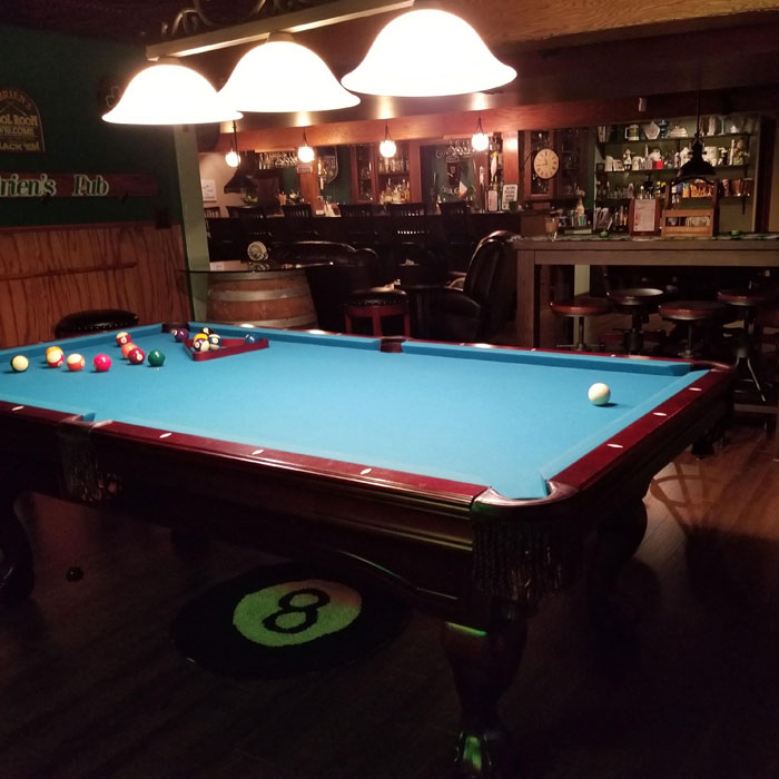 Pool table in a wooden home bar 