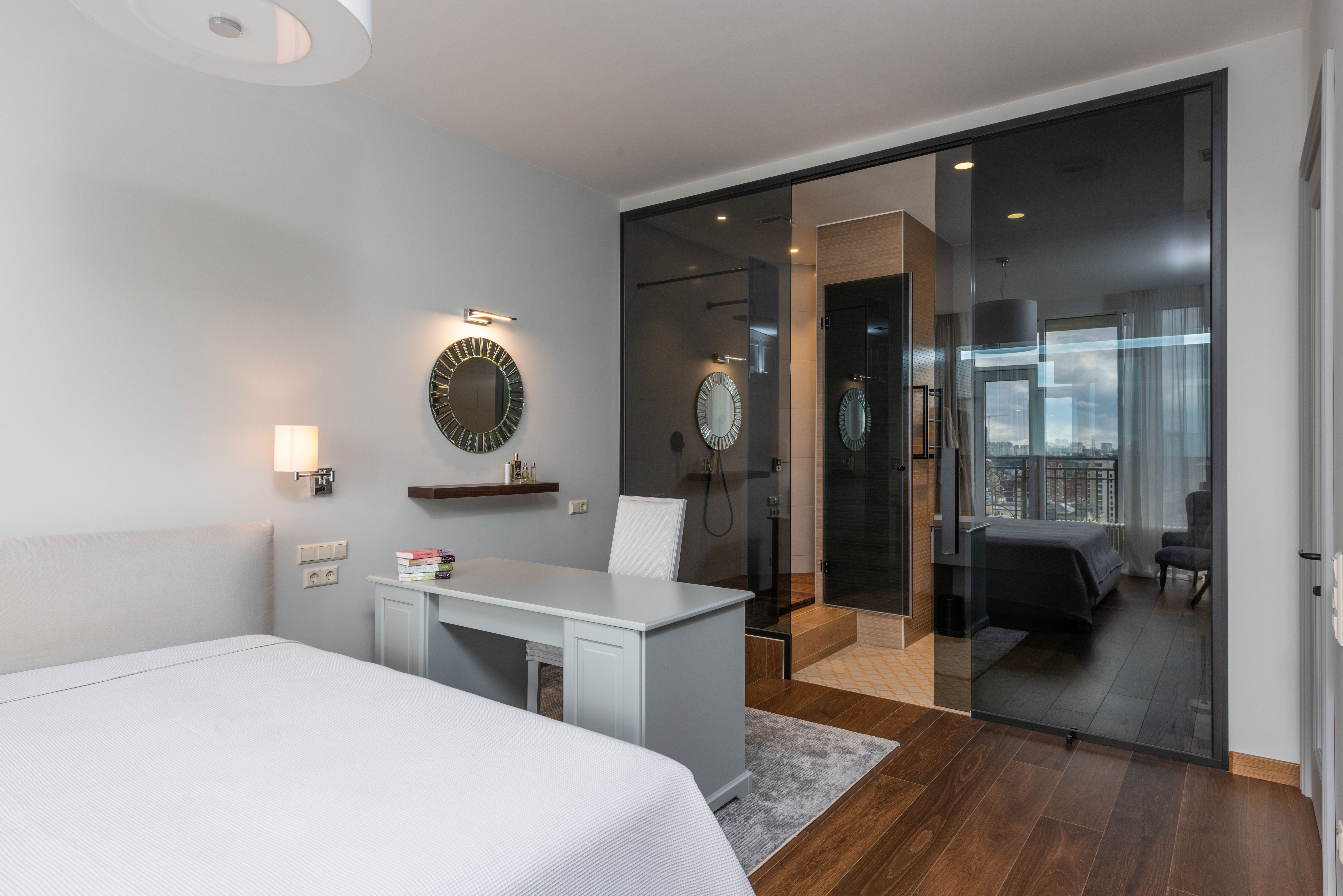 Modern bedroom with big bed and desk setup featuring a chair, ideal for home office ideas to boost productivity. Modern bedroom with big bed and desk setup featuring a chair, ideal for home office ideas to boost productivity.