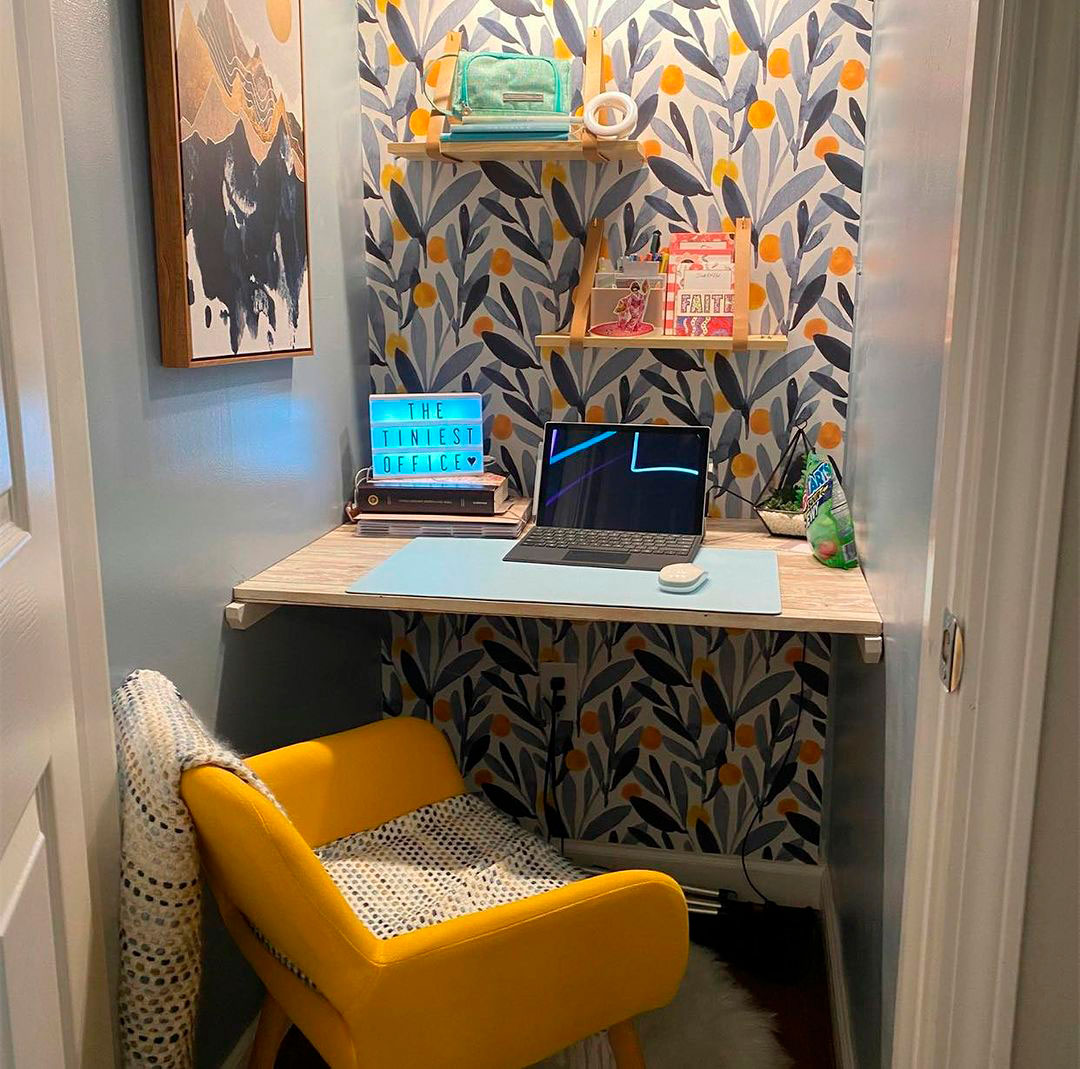 Yellow chair opposite desk with laptop