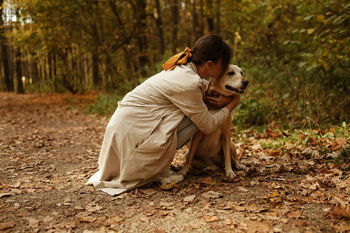 Woman hugging dog outside Woman hugging dog outside