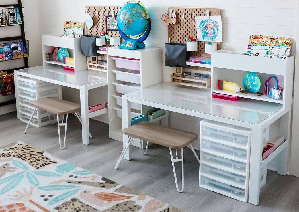 kid room with white decor and white desks with chairs